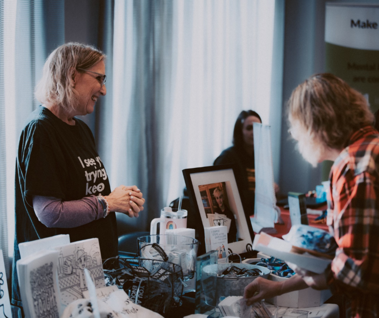 woman at exhibitor booth