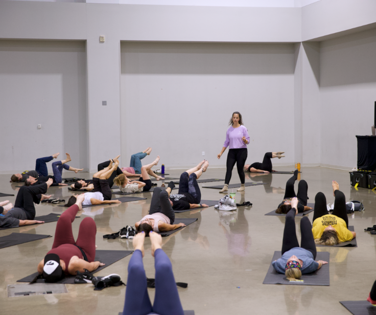 group doing indoor yoga