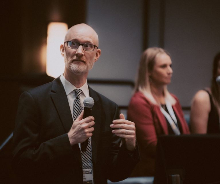 man presenting at Iowa BEST 2024