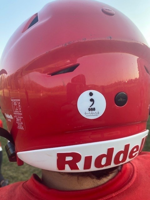 A football helmet with a 988 decal on it