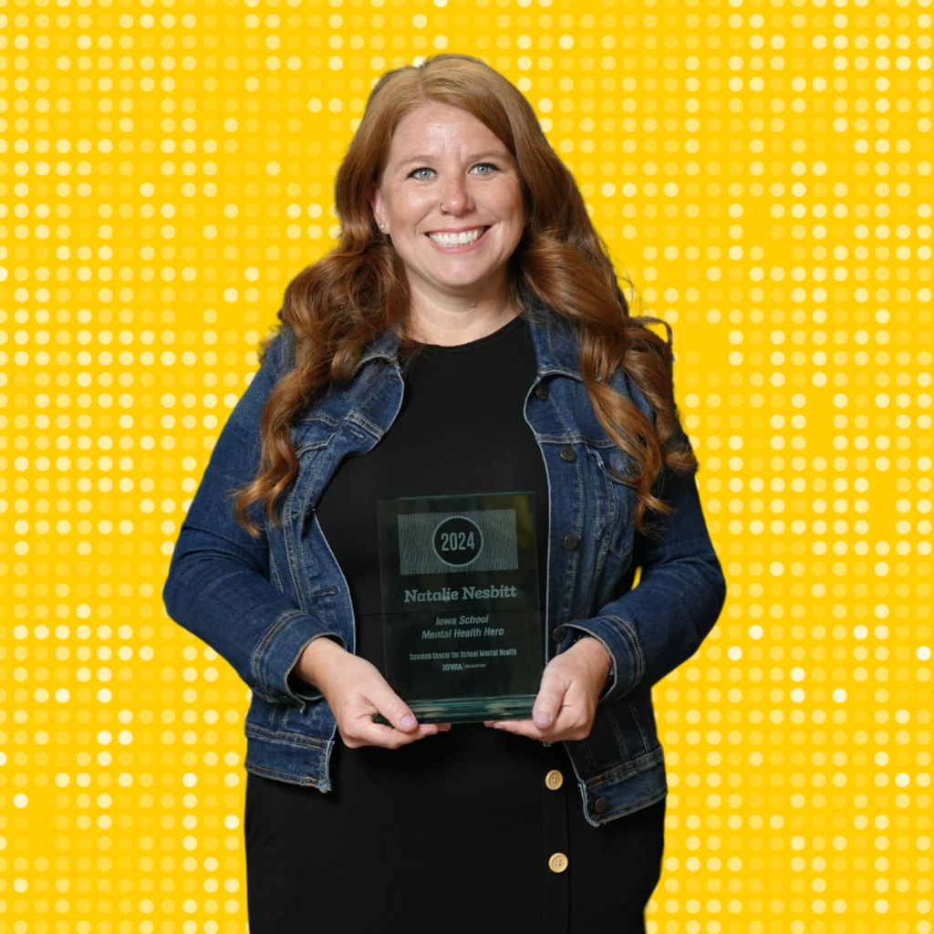 Woman posing with award