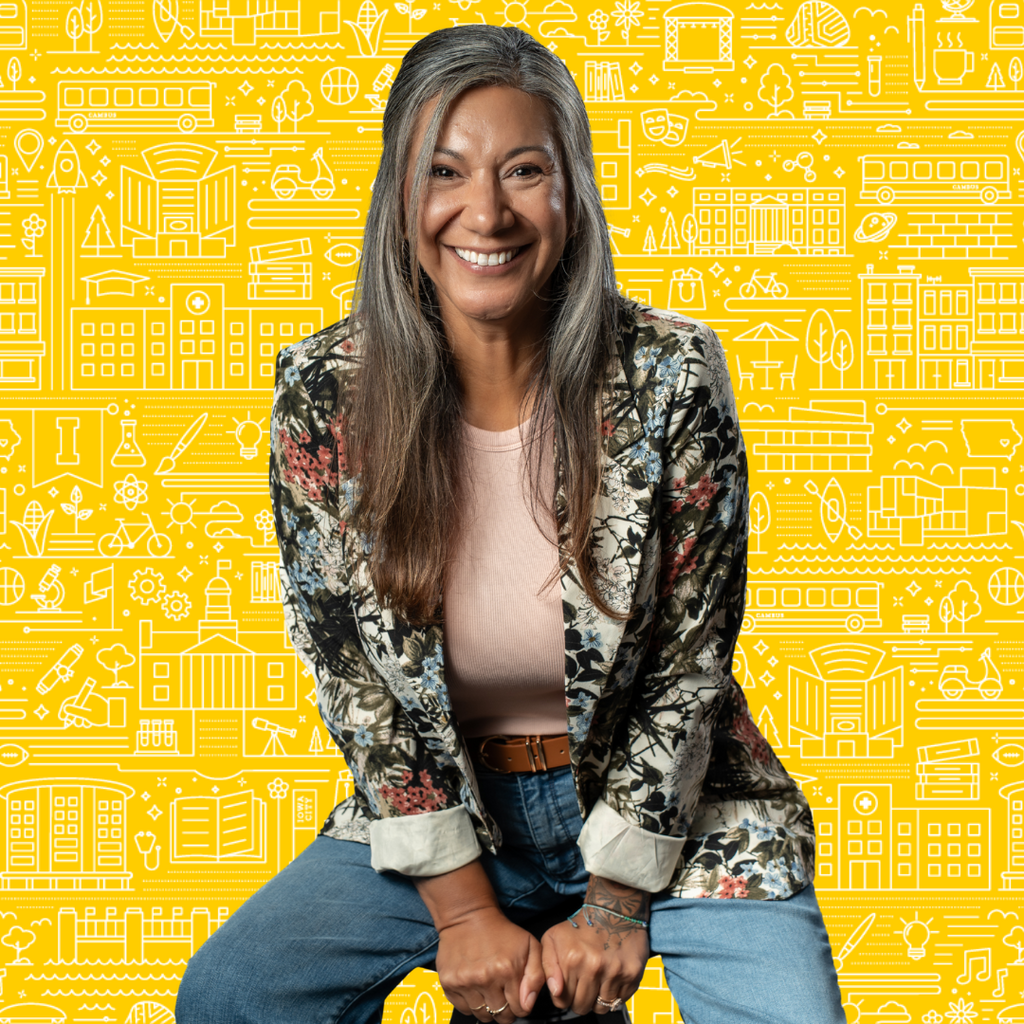 Mario Bruno sitting on a stool with a yellow textured background