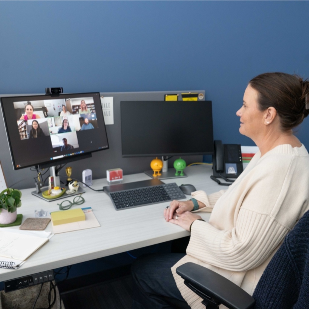 Clinician facilitating an online group counseling session with 6 people on the screen