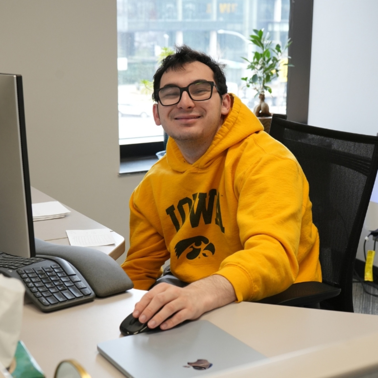 UI Reach intern Jacob Donahue at desk 