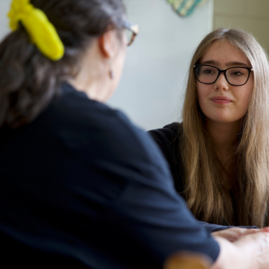 Teacher talking with student