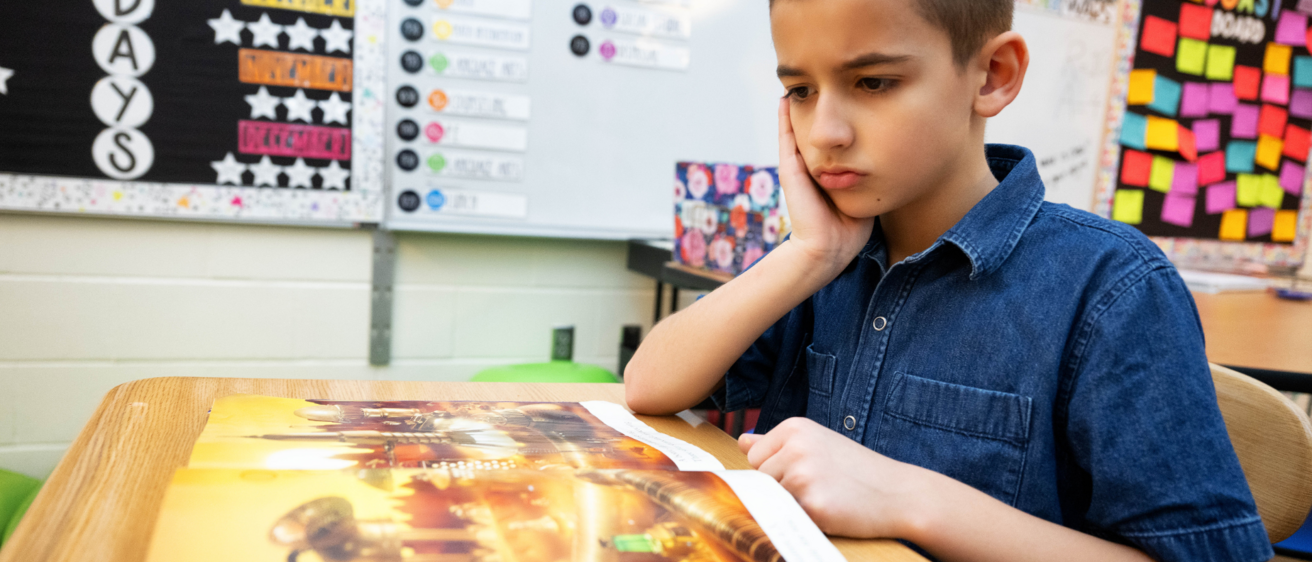 boy sitting at desk
