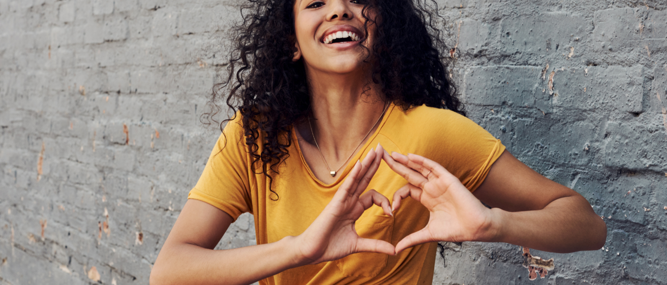 Woman making heart shape with her hands