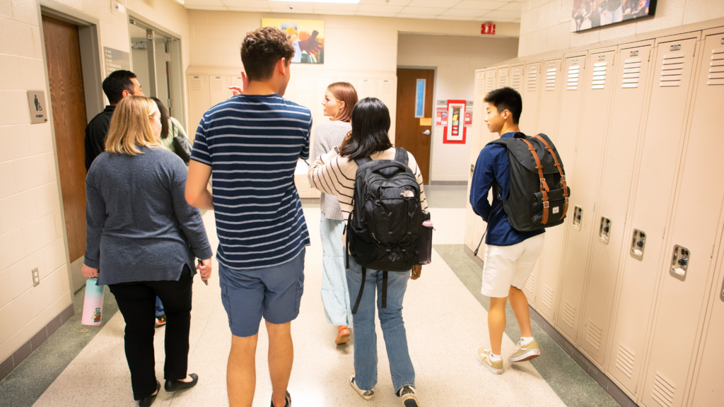 students walking down hallway