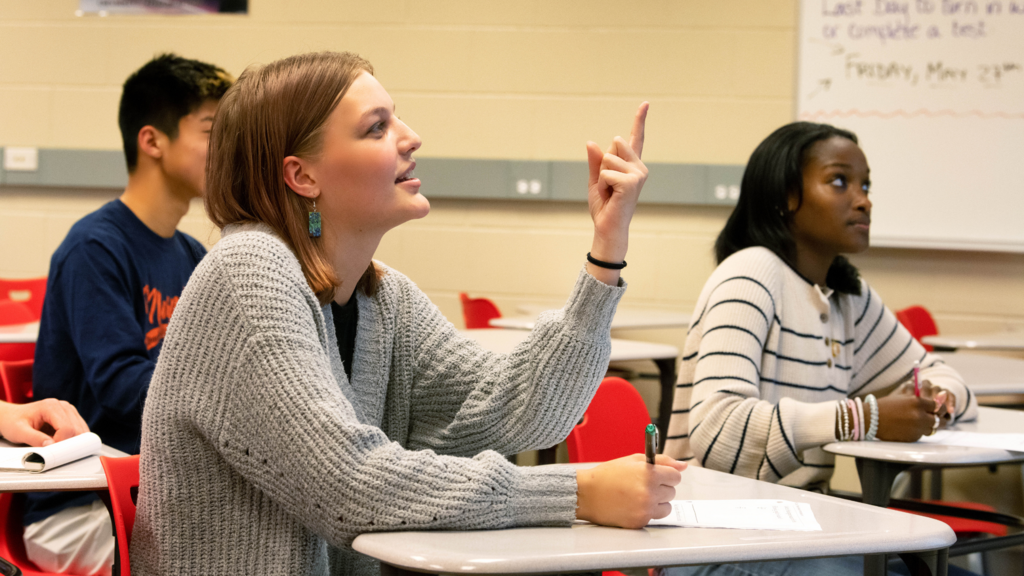 three students in class