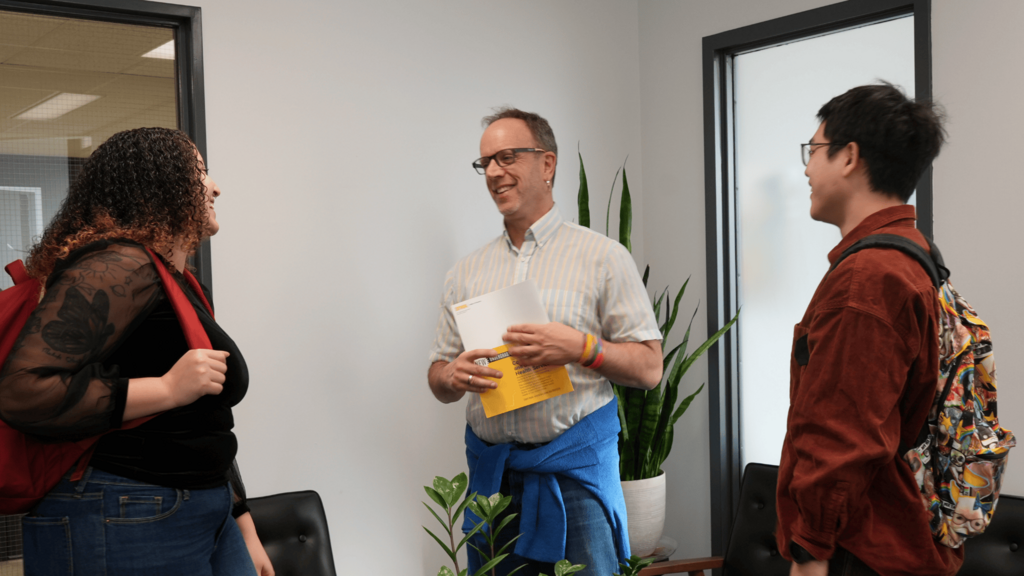 Barry Schreir with two students
