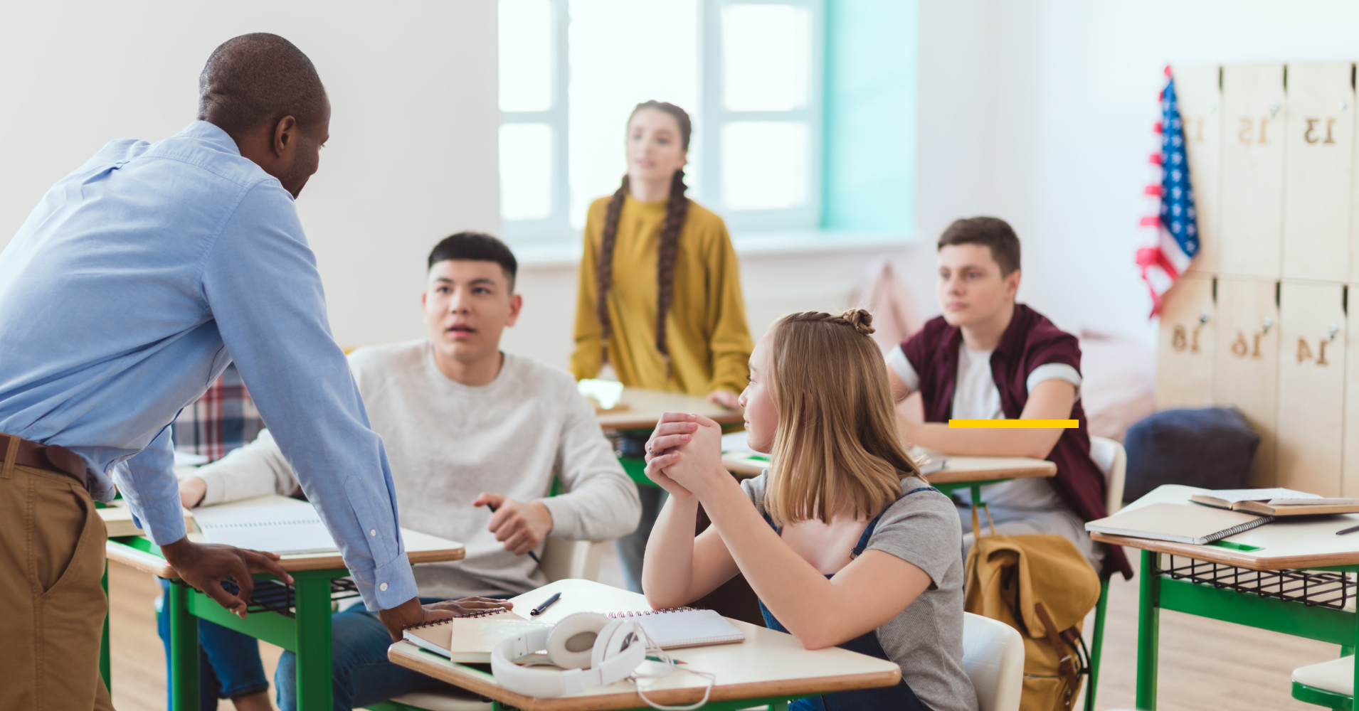 Teacher talking with four students
