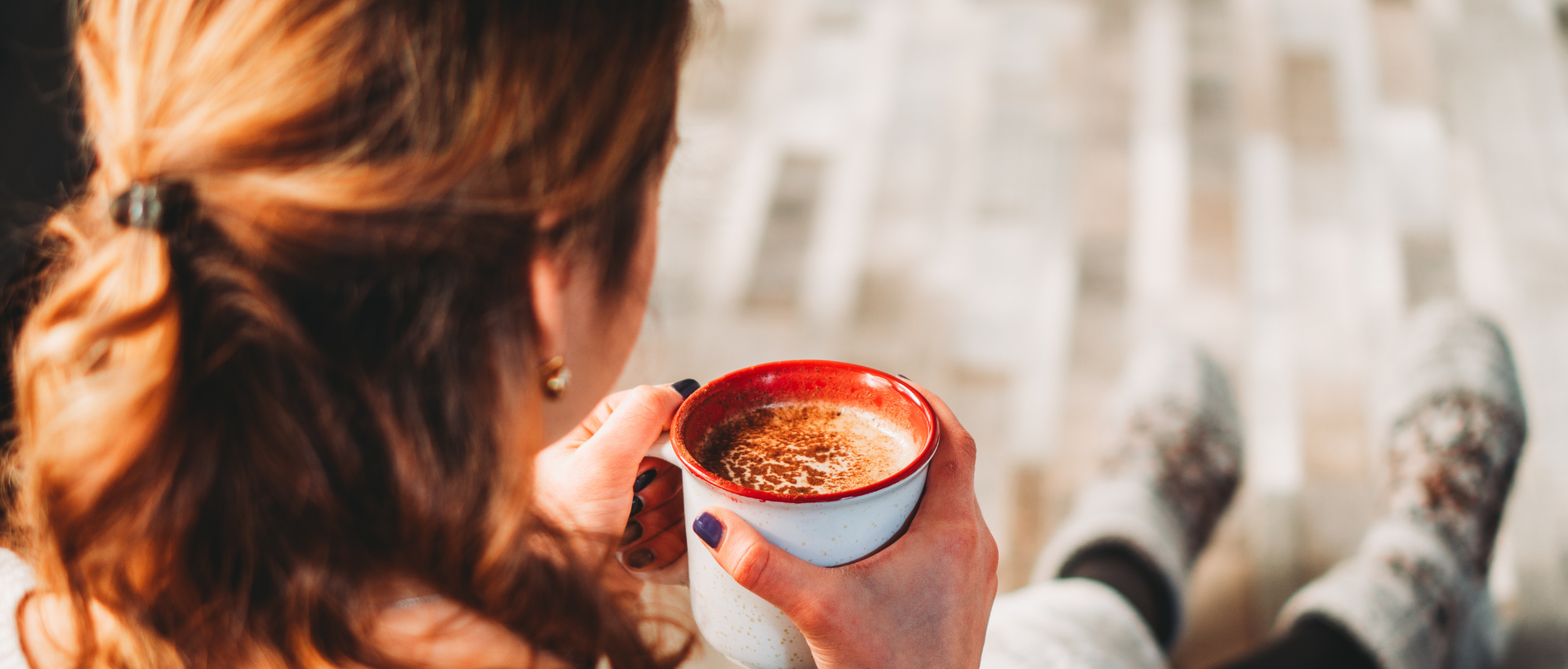 Woman holding coffee mug