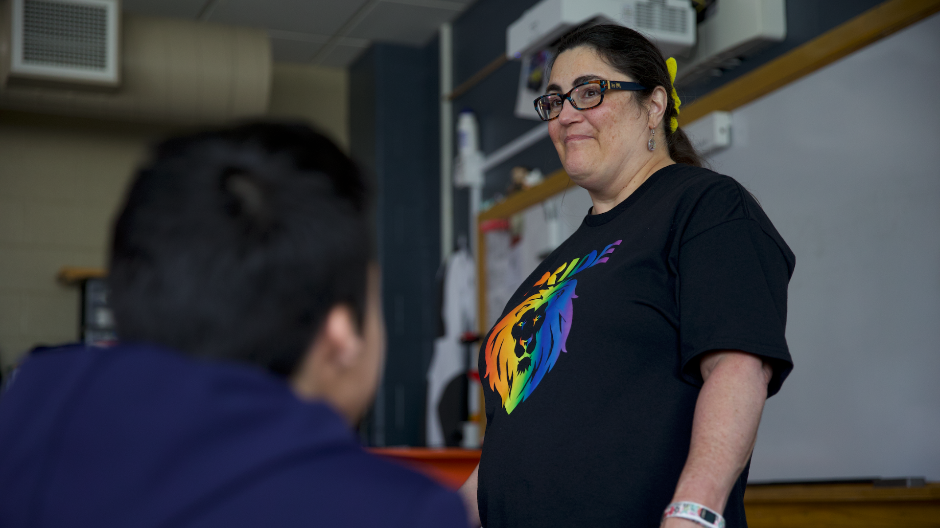 woman standing at front of classroom